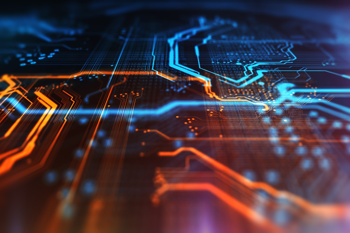Up close image of a technology chip with blue and orange coloring. 