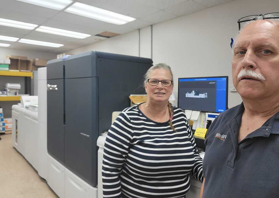 Staff of Whitlock Business Systems with their Xerox Iridesse Press