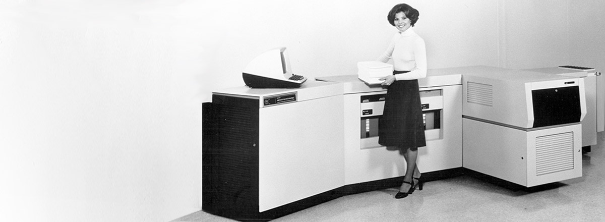 Retro black and white photo of a woman making copies