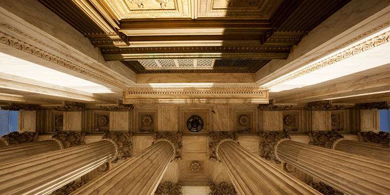 Ceiling of a law building with columns. 