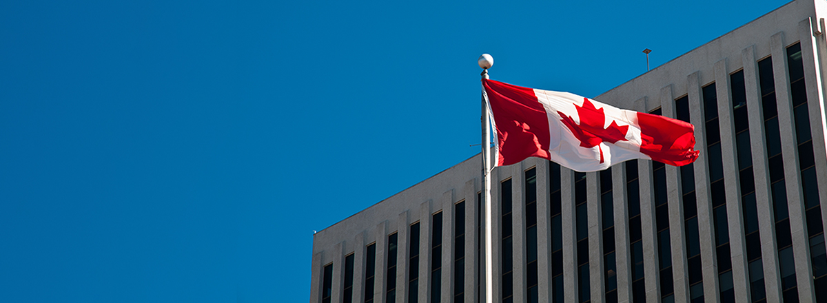 Canadian Flag in front of building