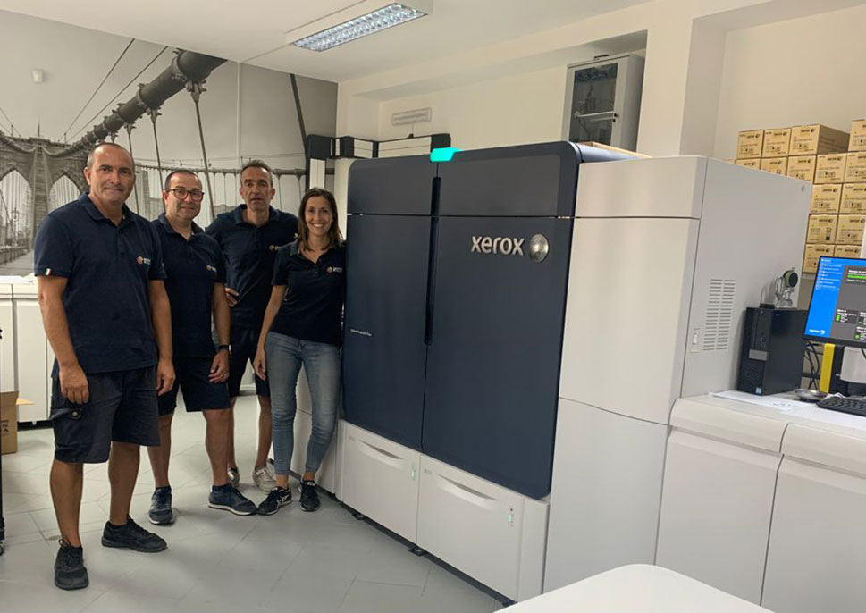 Staff of Grafiche Pilia with their Xerox Iridesse Press