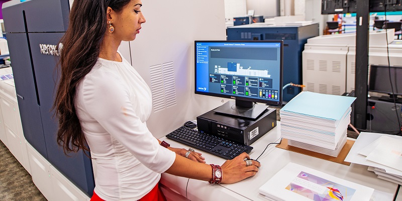 woman looking at computer screen