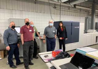 Staff of DS Graphics with their Xerox Iridesse Press