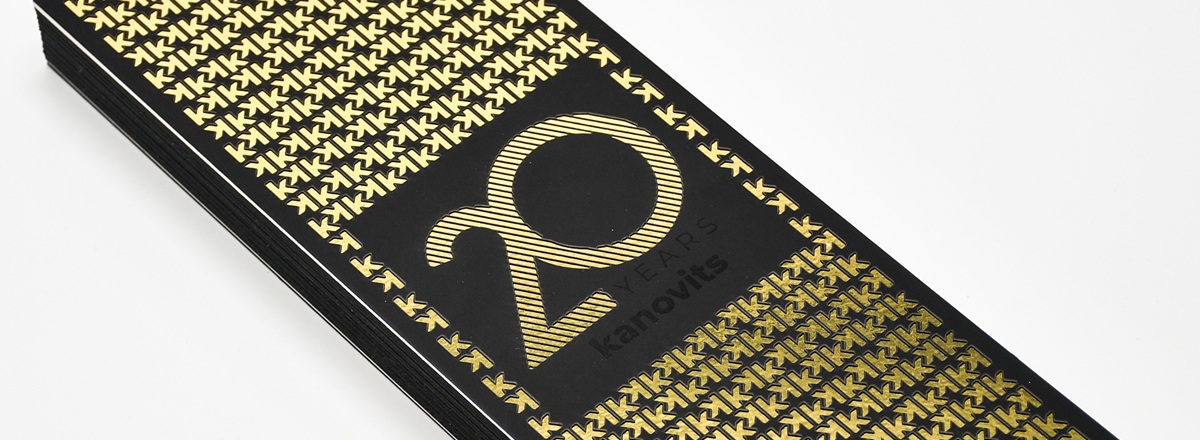 Black book cover with gold print with the words 20 YEARS kanovits, and repeating letter k