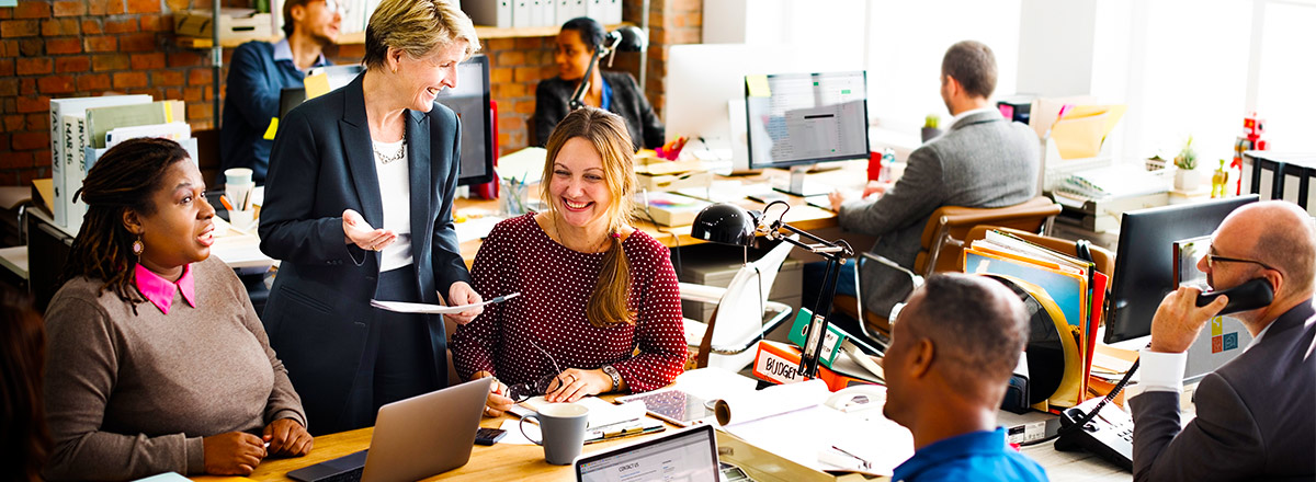 Happy people smiling and working in an office