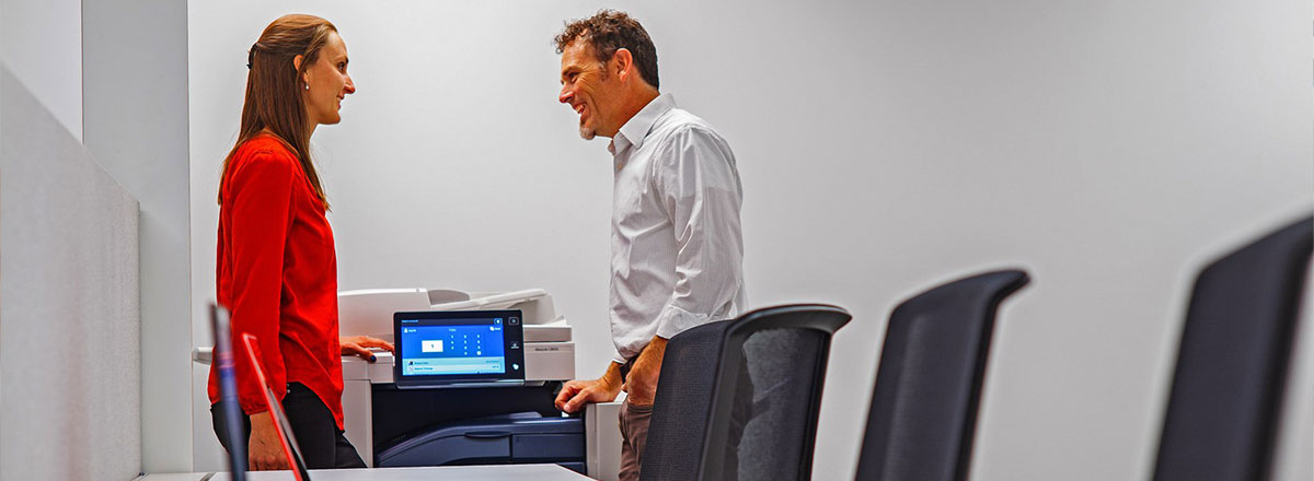 two people trying out xerox products