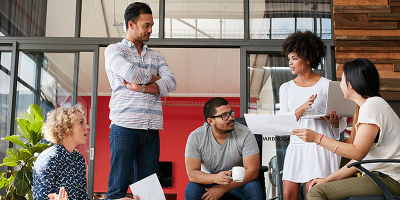 Diverse coworkers in a brightly lit, open office