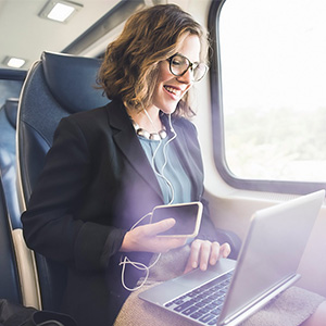 Woman on a train working from her computer