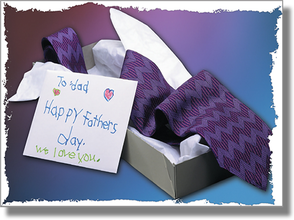 Tie in a box, with a card in a child's handwriting that says "To dad. Happy Father's day. We love you."