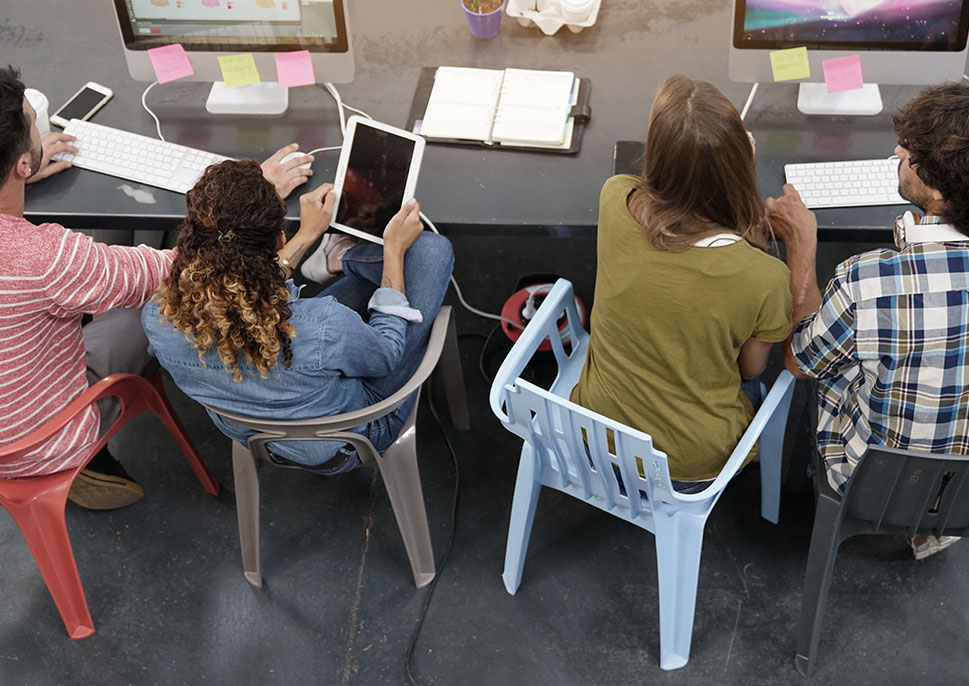 People using mobile devices at a table