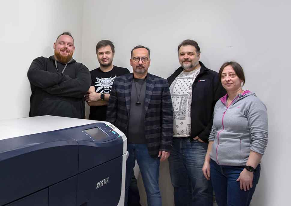 Staff of Skankolor with their Xerox Versant 4100 Press