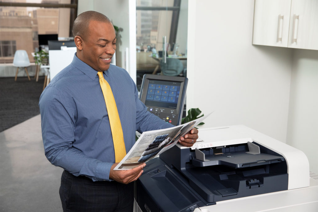 Man reviewing prints