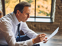 man reading paper