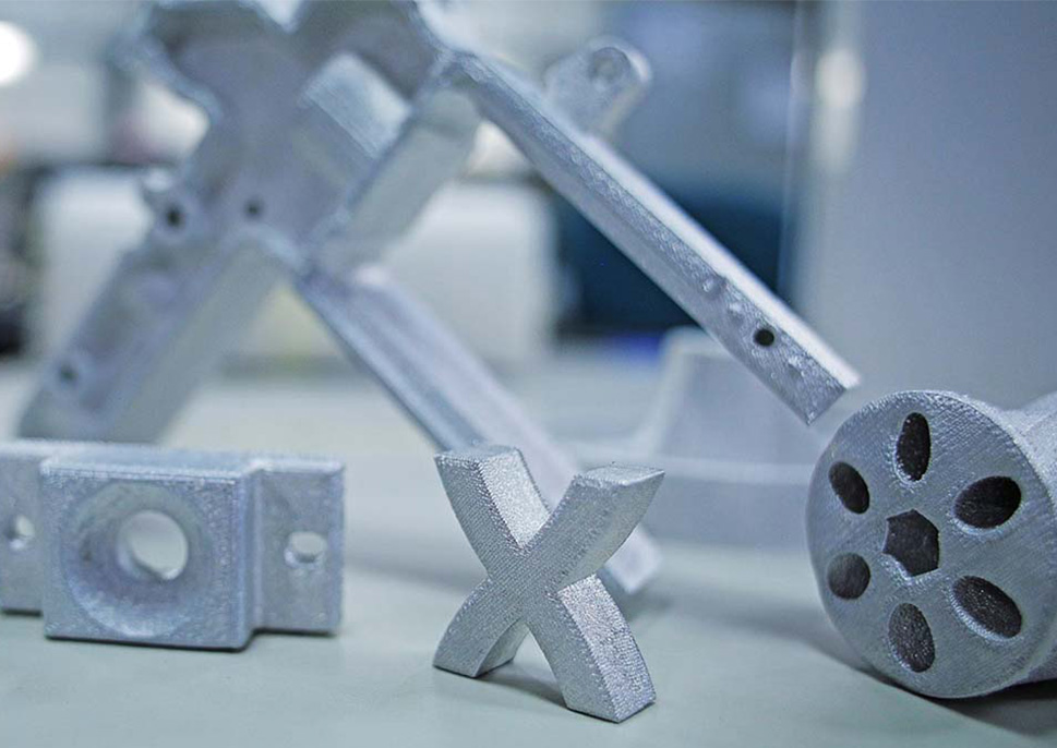 3D printed objects including a stylized Xerox "x"