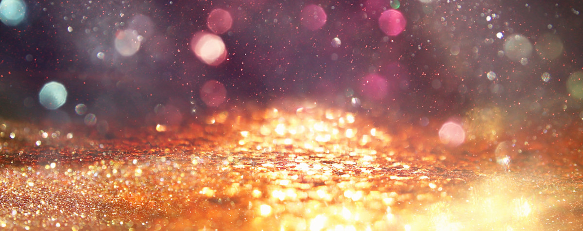 Sunlight through gold sparkles