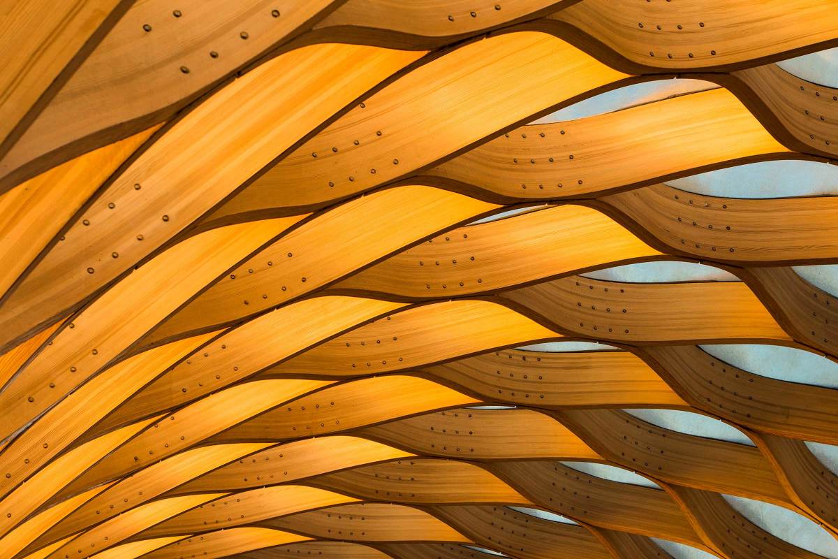 Wavy wood panels arranged in a repeating geometric pattern