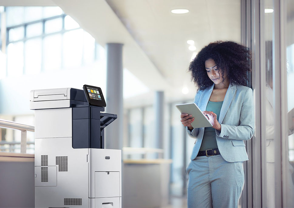 Woman with a tablet printing to a Xerox MFP