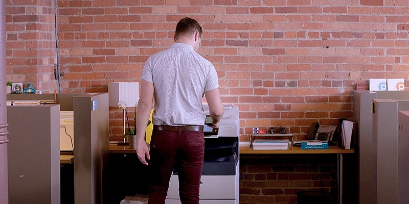 Print user making copies at an MFP