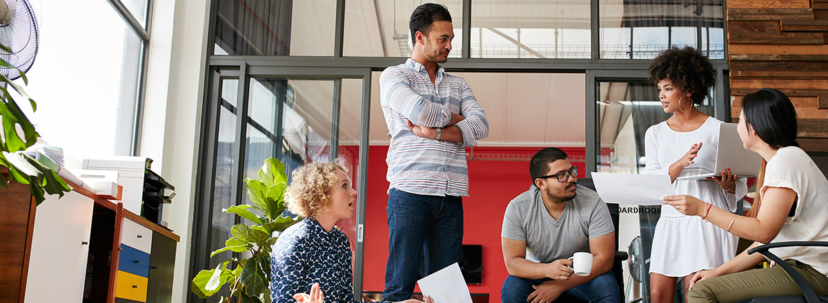 Diverse coworkers in a brightly lit, open office