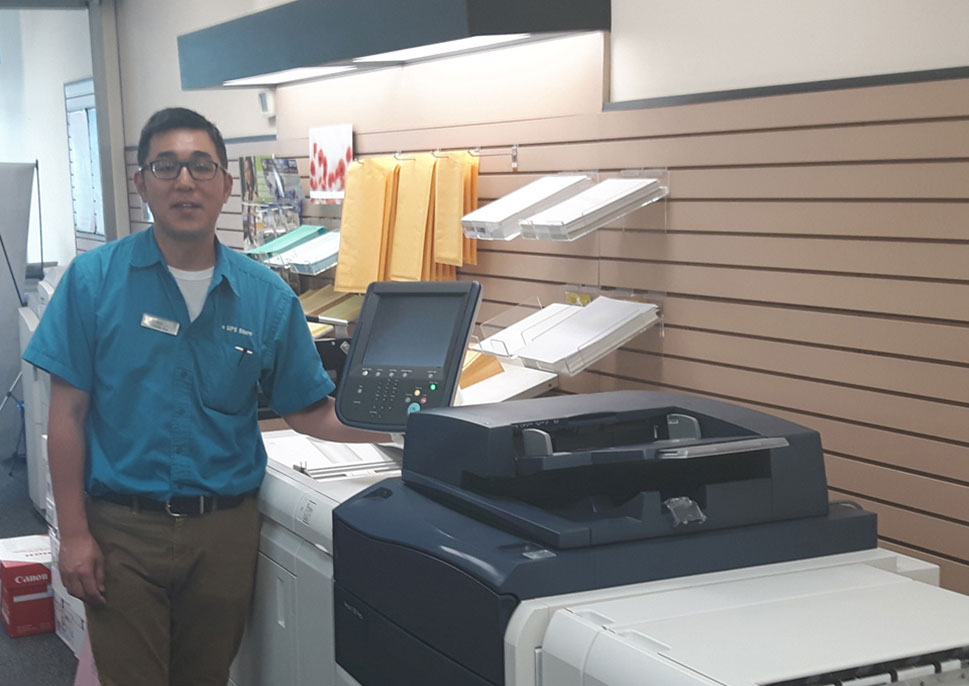 Sannick Kim of The UPS Store with their Versant 180 Press