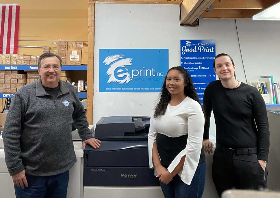 Staff of E Print INC with their Xerox Versant 280 Press