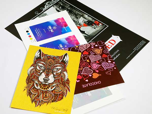 Stack of colorful print samples, printed on a Xerox Iridesse Production Press