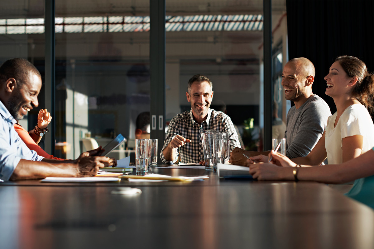 Happy coworkers in a boardroon meeting