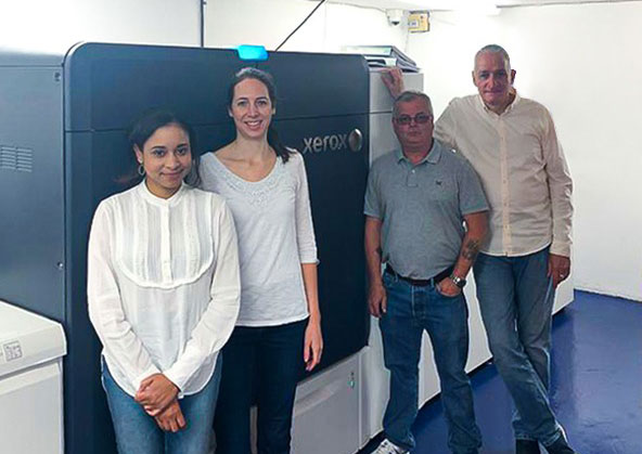 Staff of Vizability Media Group with their Xerox Iridesse Press
