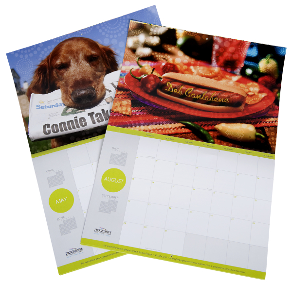 Two personalized calendars. One has a dog with a newspaper in its mouth, one has a hot dog with a name written in mustard.