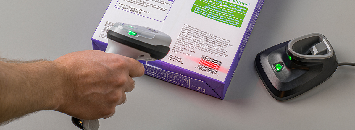 Person scanning a printed bar code