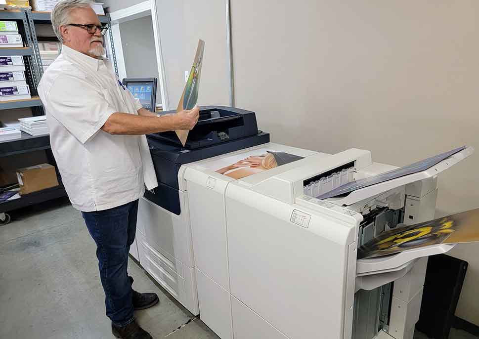 Disc Pro Graphics & Printing with their Xerox Versant 280 Press
