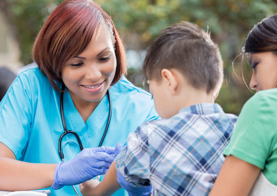 A nurse checking a child