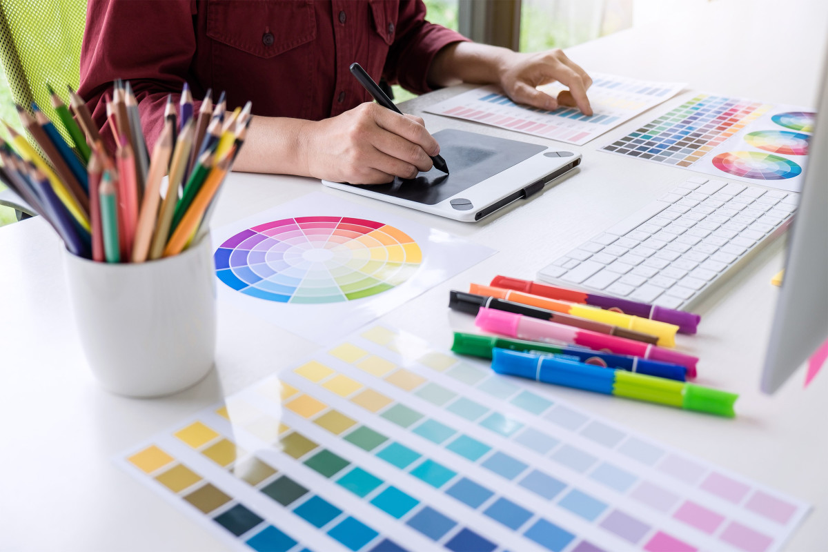 Graphic artist using a pen/tablet with a color wheel