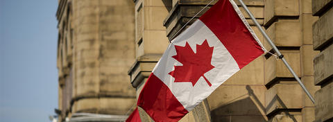 Photo of Canadian Flag on a Government Building