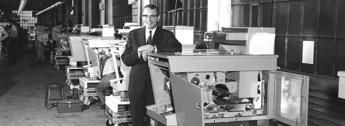 Joseph Wilson with an early model Xerox copier