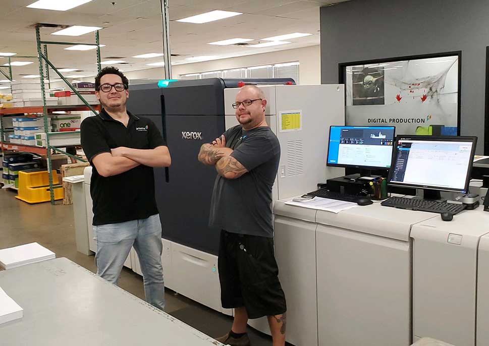 Staff of Prisma Graphic with their Xerox Iridesse Press