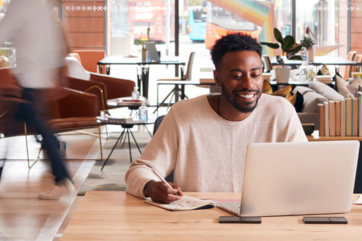 black man working on laptop in an office