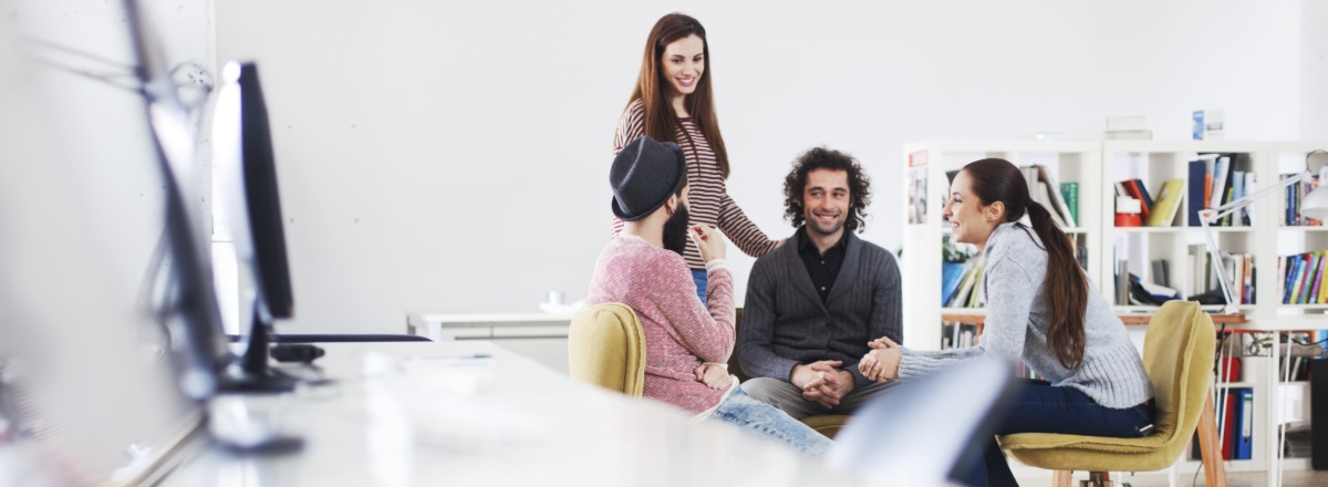 College students in a brightly lit room, with a blurred Xerox MFP in the foreground