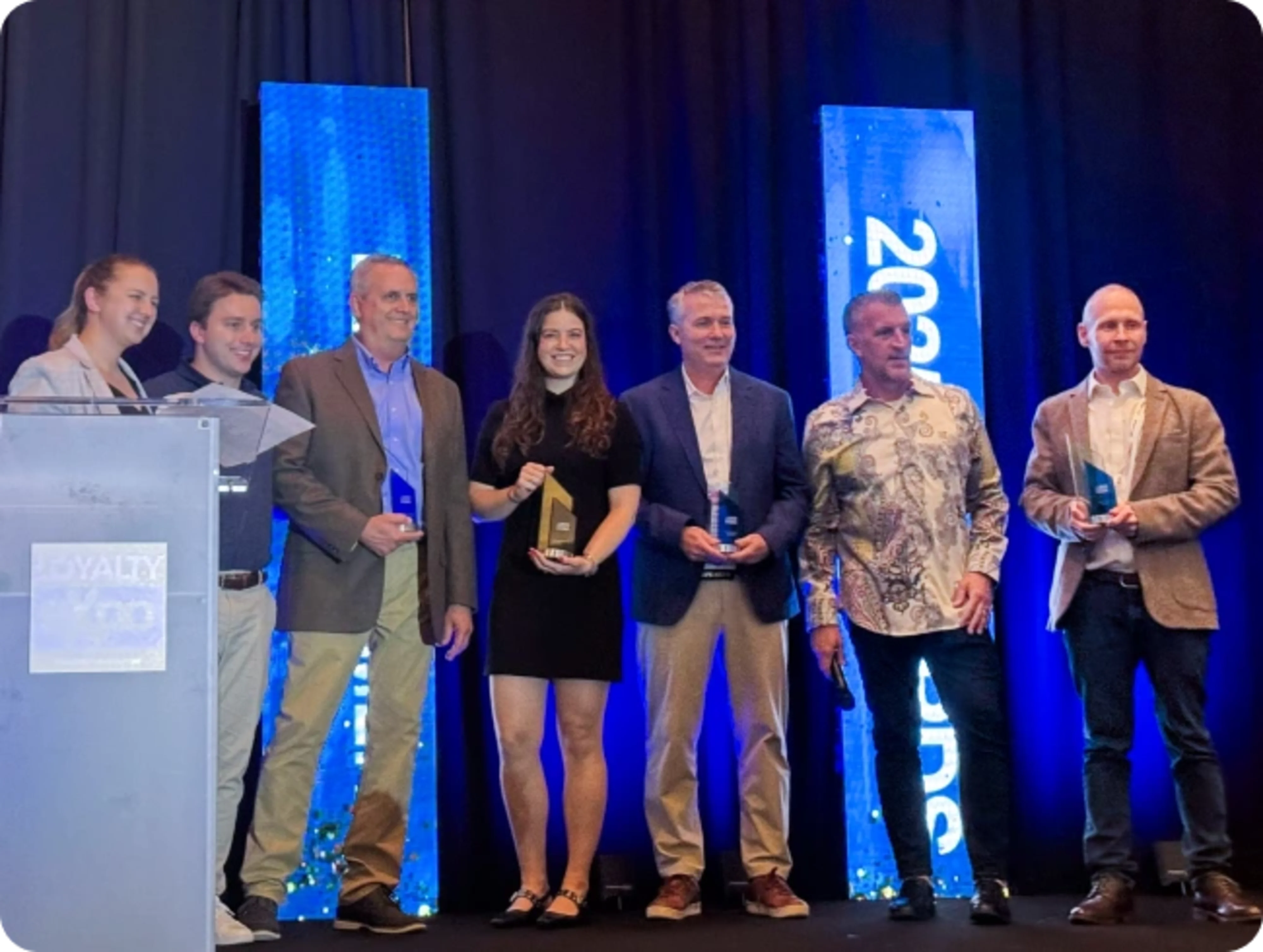 Loyalty360 conference award acceptance on stage