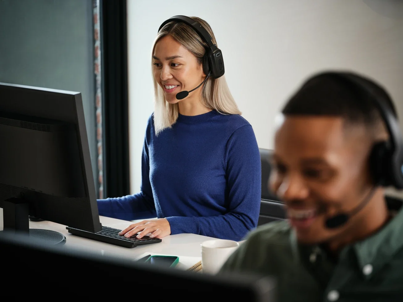 Friendly support agents providing live assistance, highlighting Chime’s 24/7 customer service commitment.