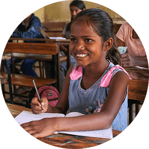 Female child writing in classroom