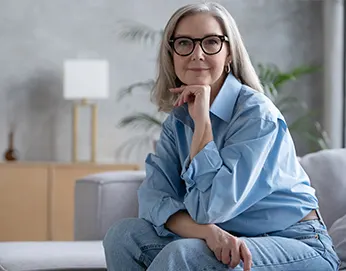 Smiling middle-aged woman with glasses