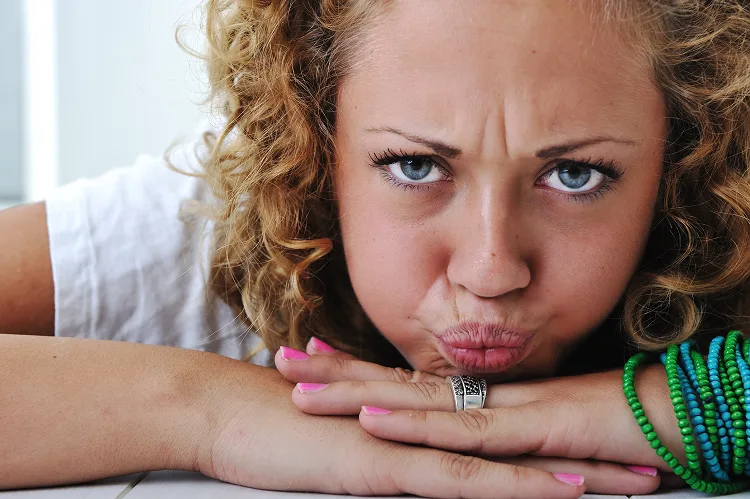 Portrait of a girl frowning