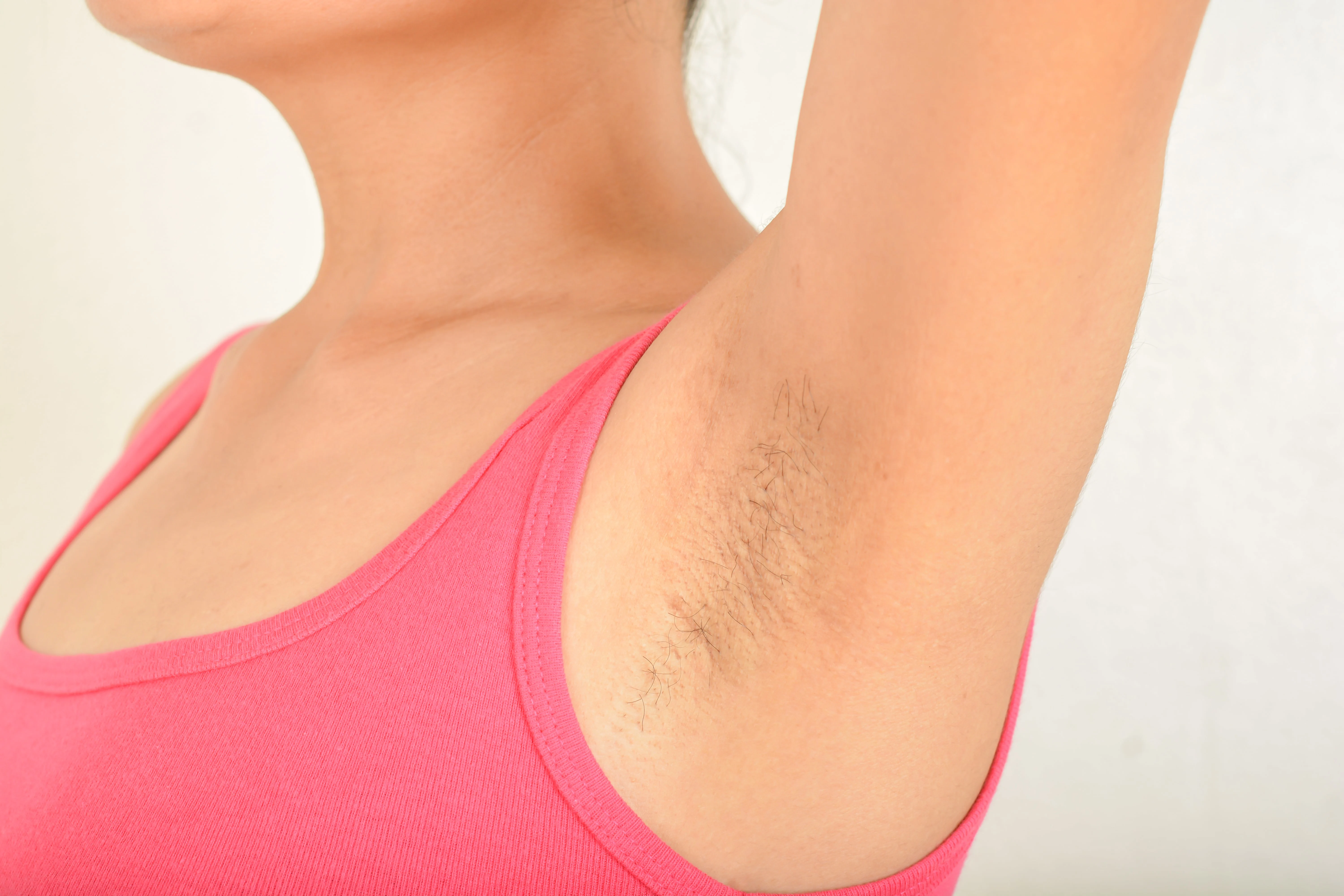 Women's armpit with hair on it