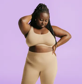 Worried woman looking down with the message vaginal discharge