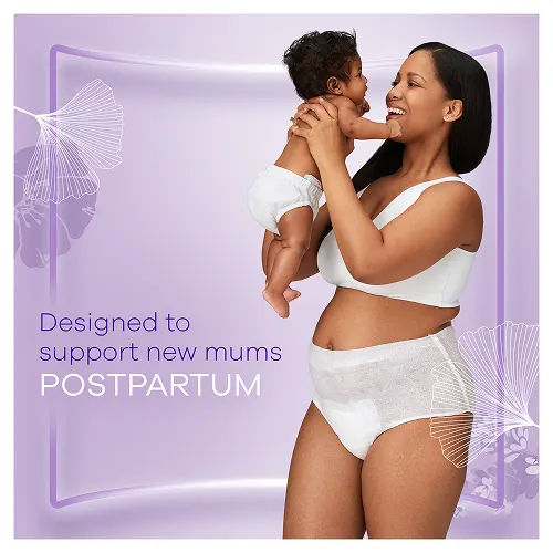 Mum wearing postpartum pants carrying her newborn baby