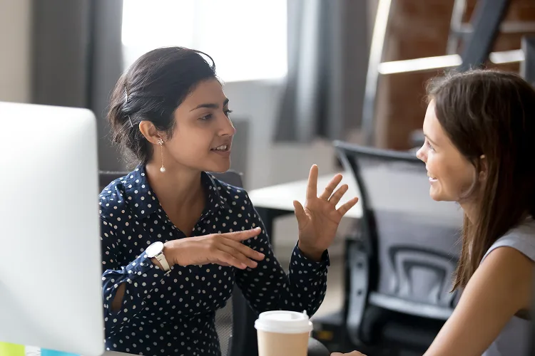 Two women talking to each other