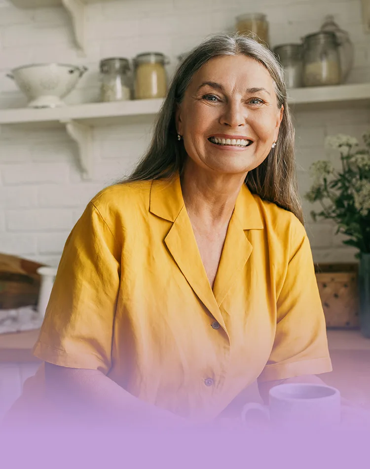 Smiling middle-aged woman in the kitchen