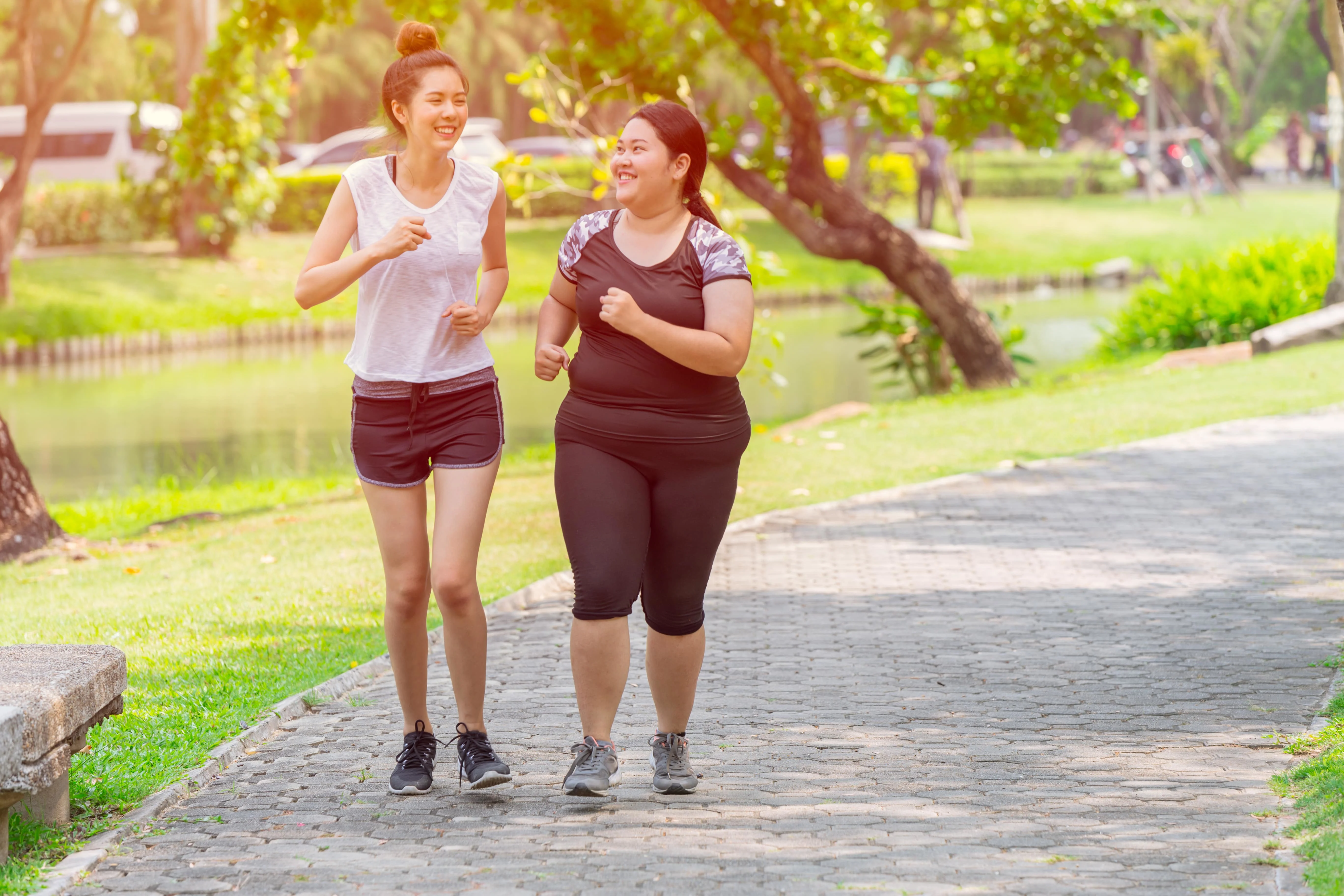 Two girls running in the park